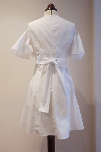 white cotton dress with floral embroideries and angel sleeves