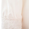long sleeved tunica blouse LORI in white silk satin with v-neck and hand knitted crochet lace trims
